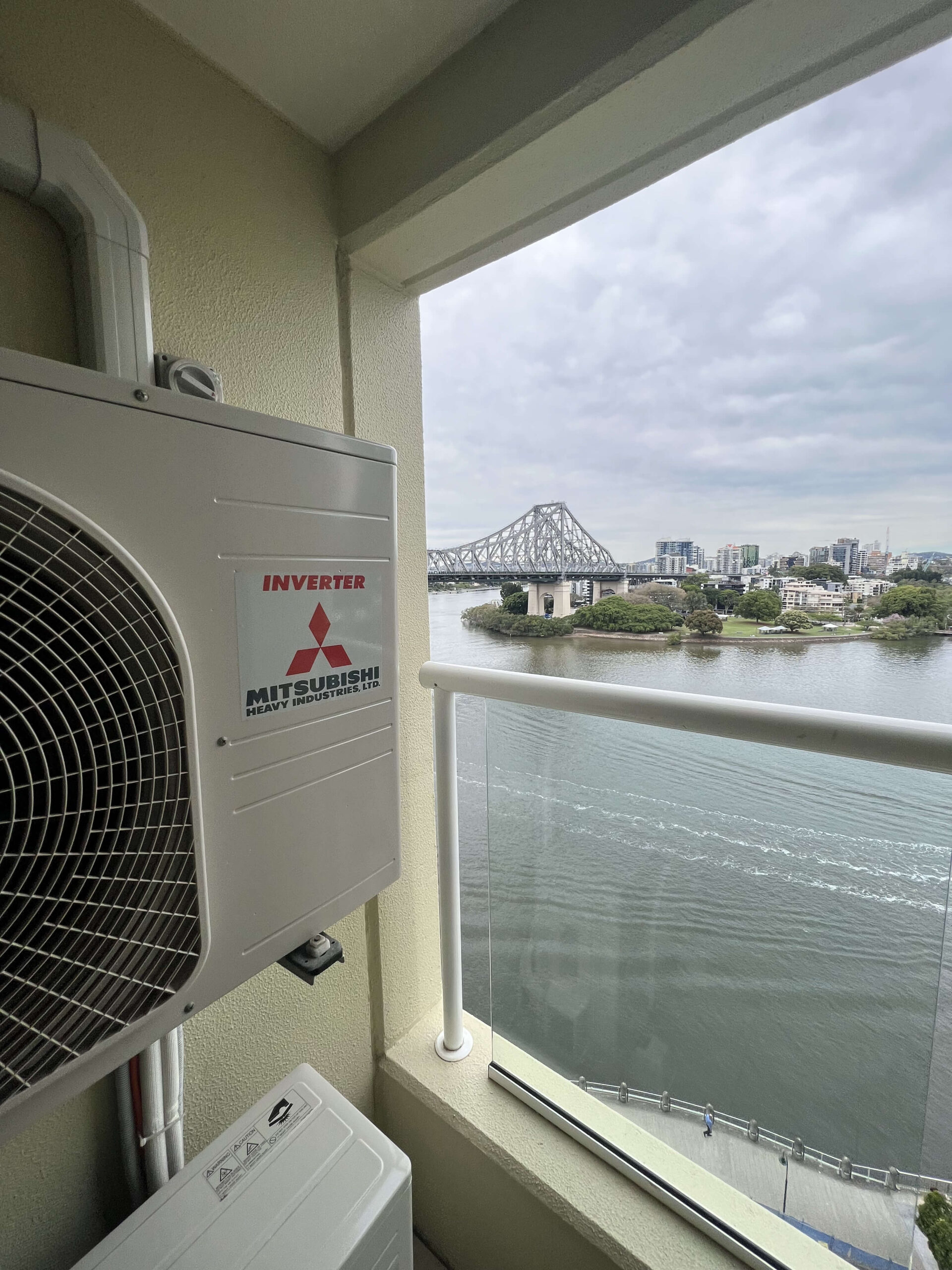 Aircon unit on a balcony overlooking the Story Bridge.