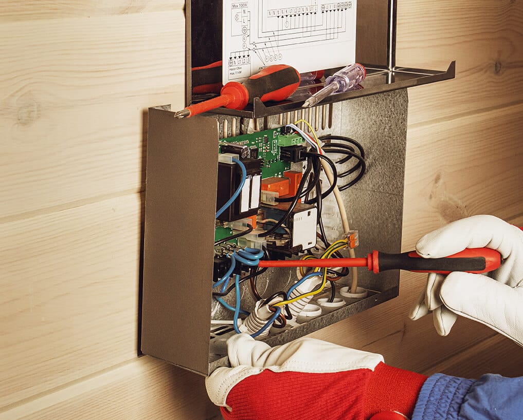 A sauna being installed by an electrician.