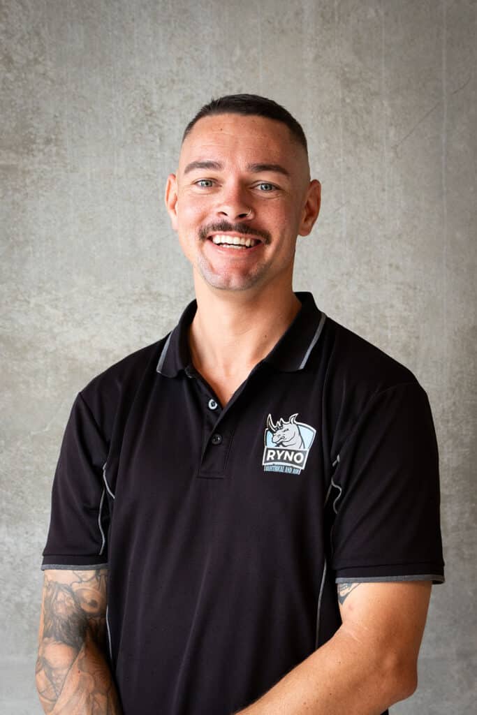 A professional headshot of Ryan from Ryno Electrical and Air.
